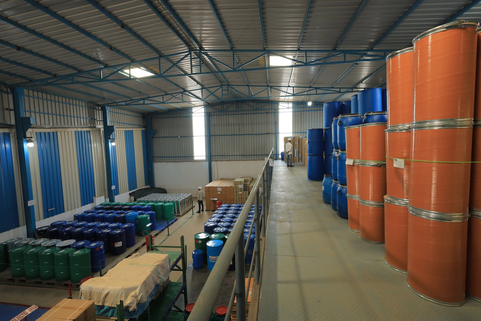 Solvent drums and fibre drums staged for bulk supply in the SRPL packing warehouse